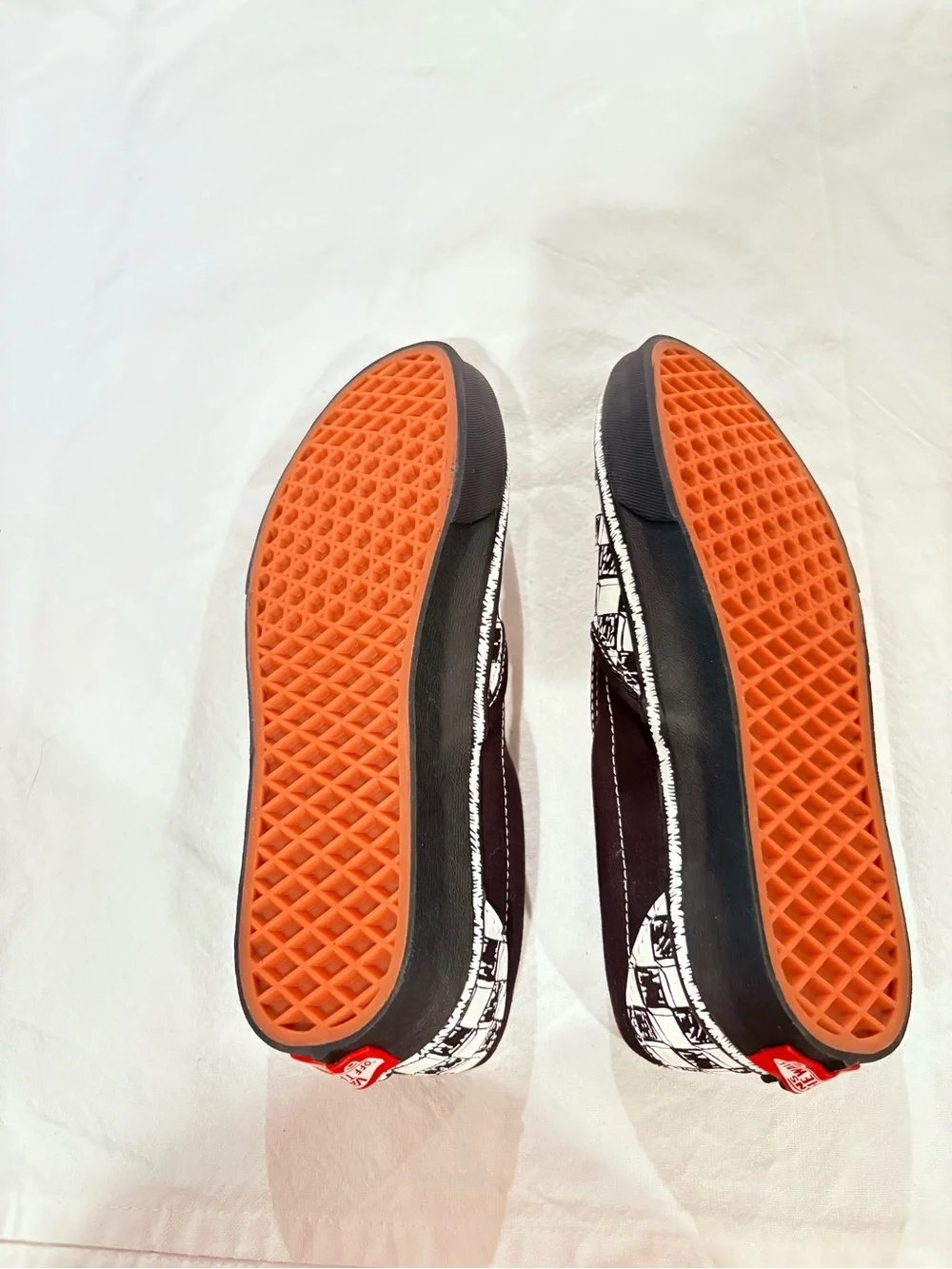 Vans Black and White Checkerboard Slip-On Sneakers